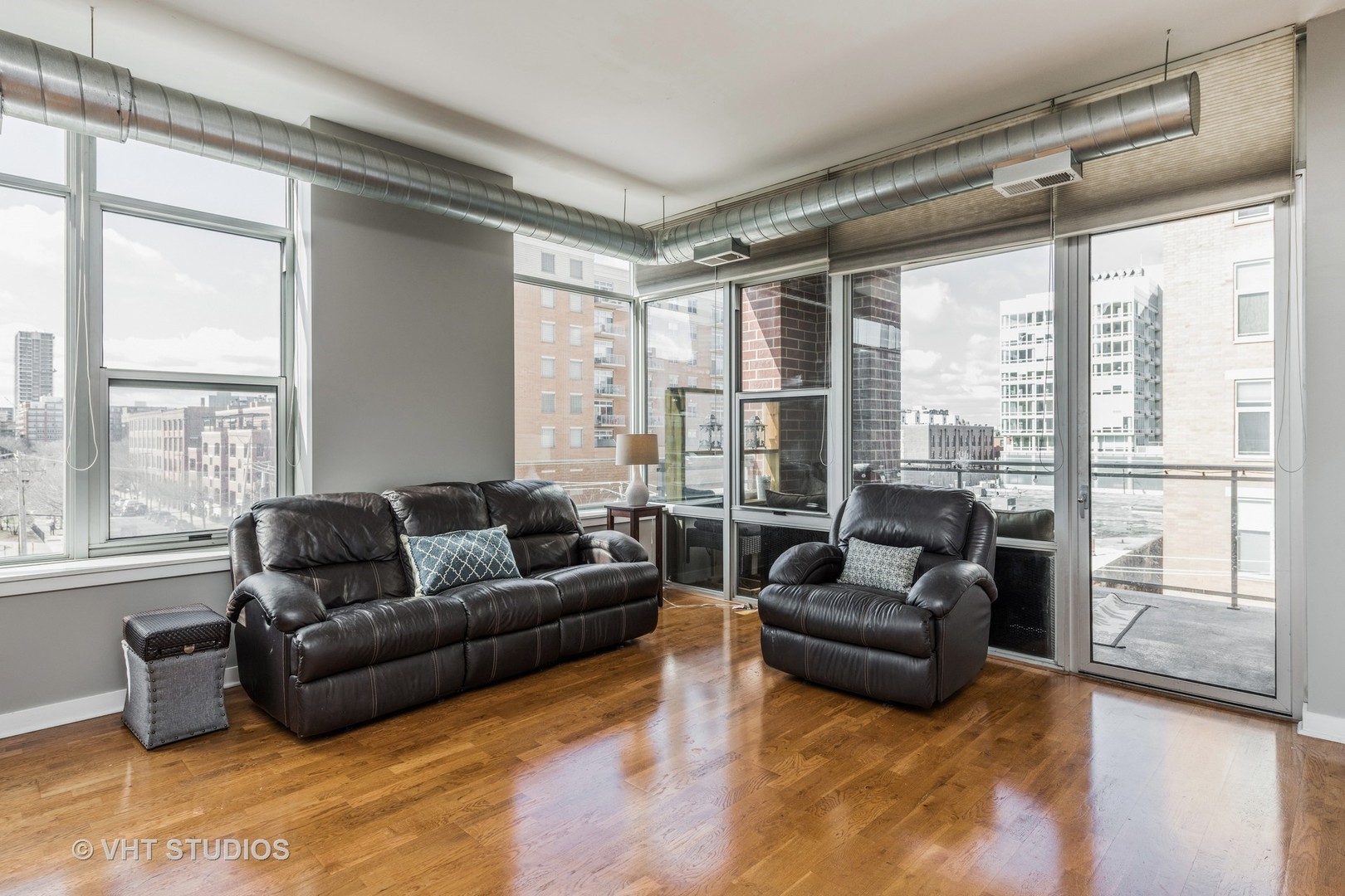 901 West Madison Street, Unit 407 Chicago, IL 60607 - Photo 2 of 11 a living room with furniture and a large window
