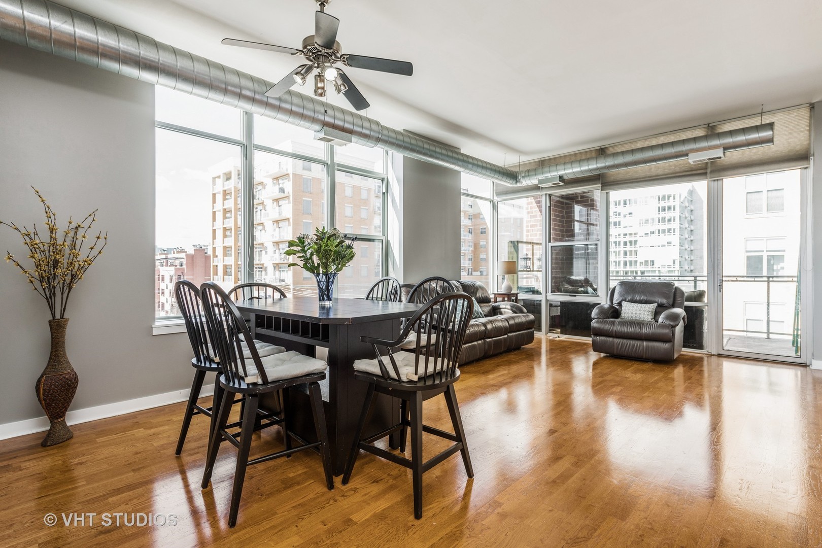 901 West Madison Street, Unit 407 Chicago, IL 60607 - Photo 3 of 11 a view of a dining room with furniture window and wooden floor
