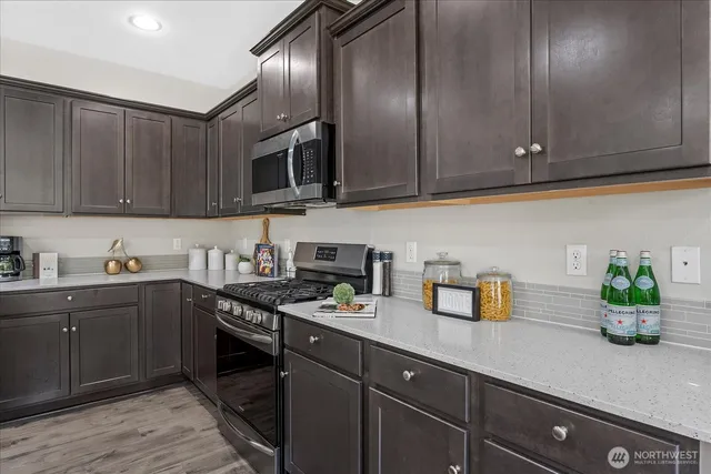 a kitchen with cabinets a sink and wooden cabinets