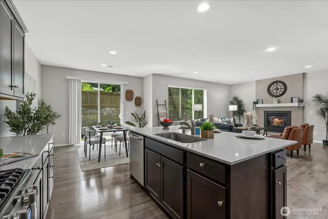 a kitchen with sink cabinets and wooden floor