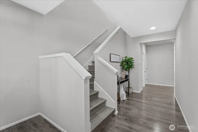 a view of entryway with stairs and wooden floor