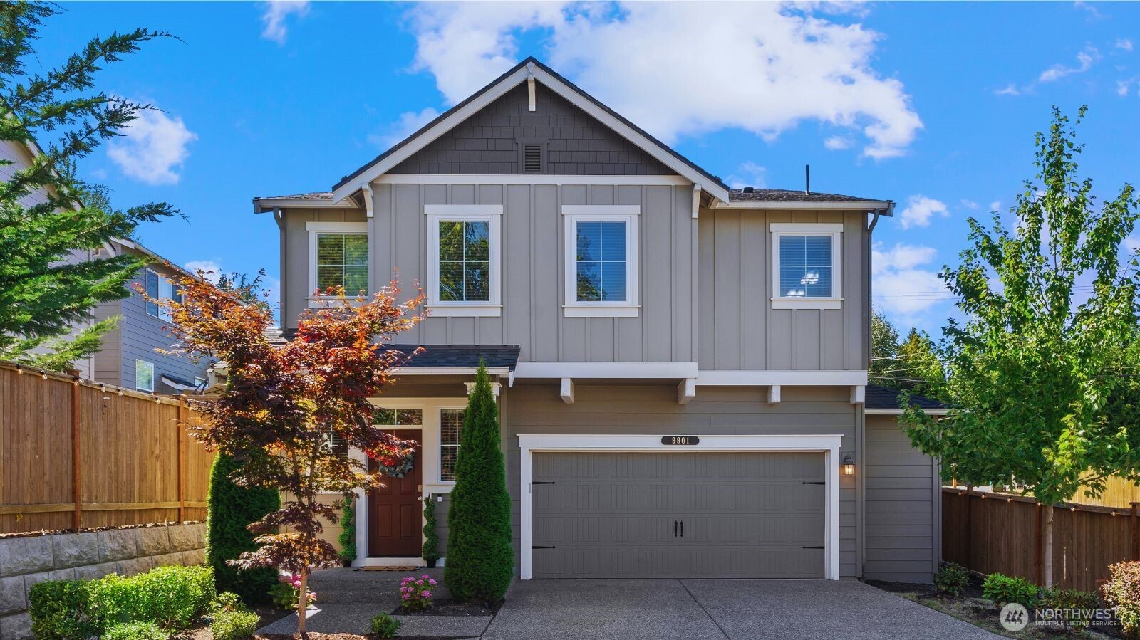 9901 13th Street Southeast Lake Stevens, WA 98258 - Photo 2 of 39 a front view of a house with a yard