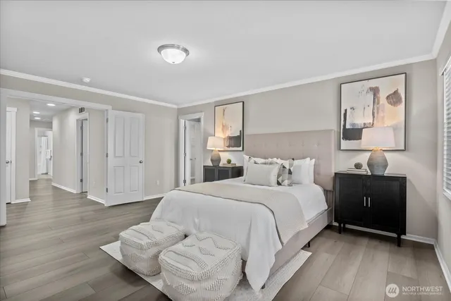 a bedroom with a bed and a night stand