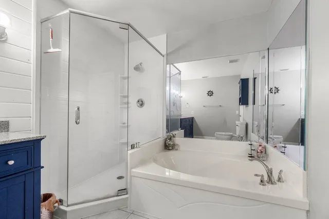 a white bath tub sitting next to a bathroom