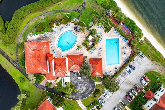 an aerial view of a house with a swimming pool