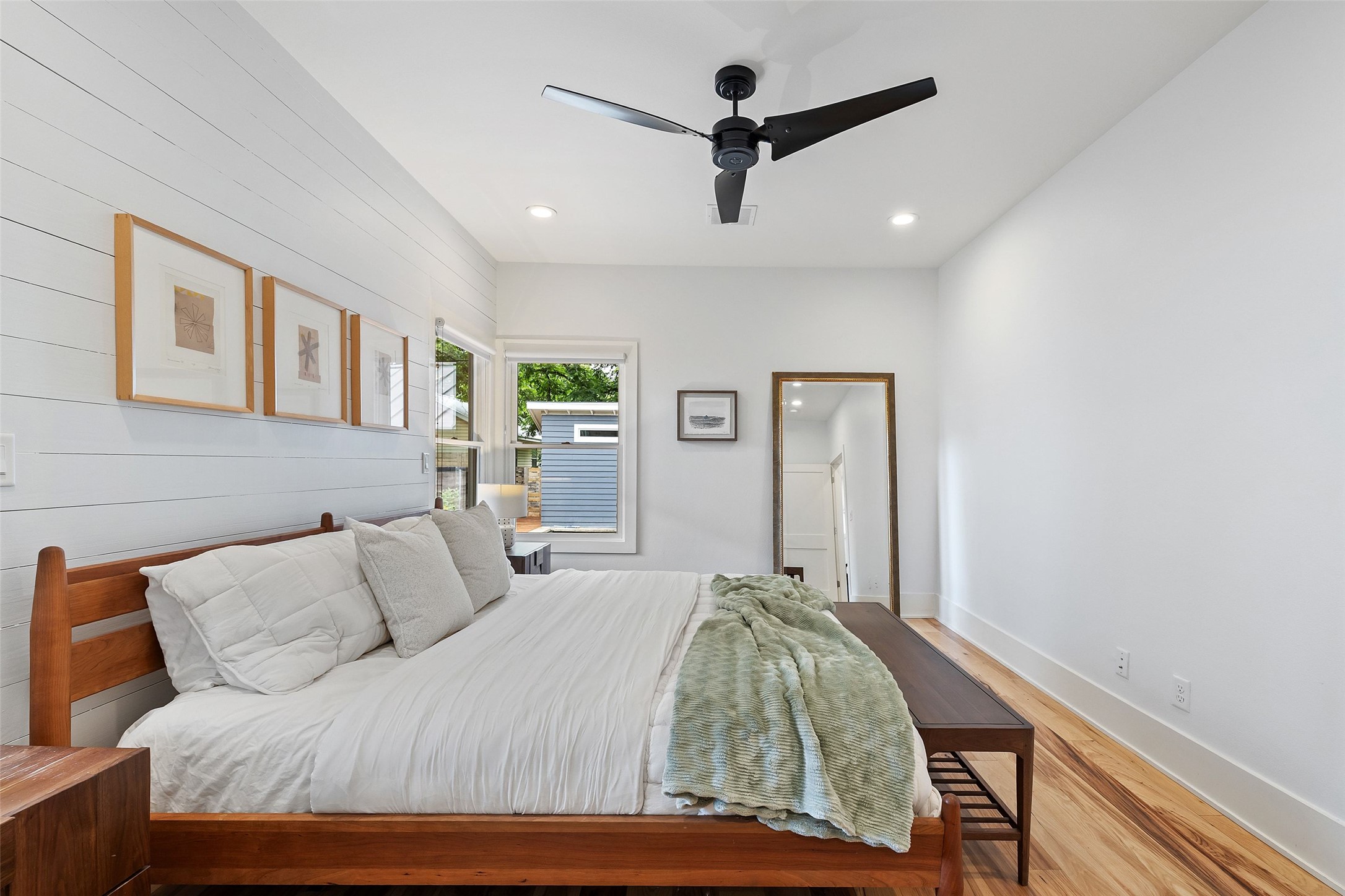 2000 Rundell Place Austin, TX 78704 - Photo 22 of 38 A tranquil bedroom retreat features sleek recessed lighting and warm wood flooring.