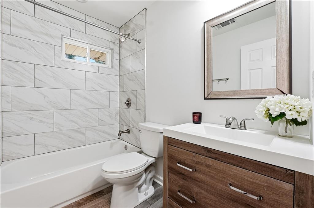 2629 Henderson Road Tucker, GA 30084 - Photo 11 of 31 a bathroom with a sink a toilet and shower