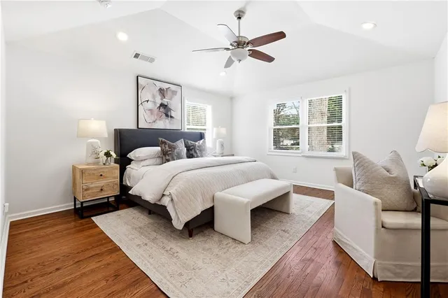 a bedroom with a bed couch and window