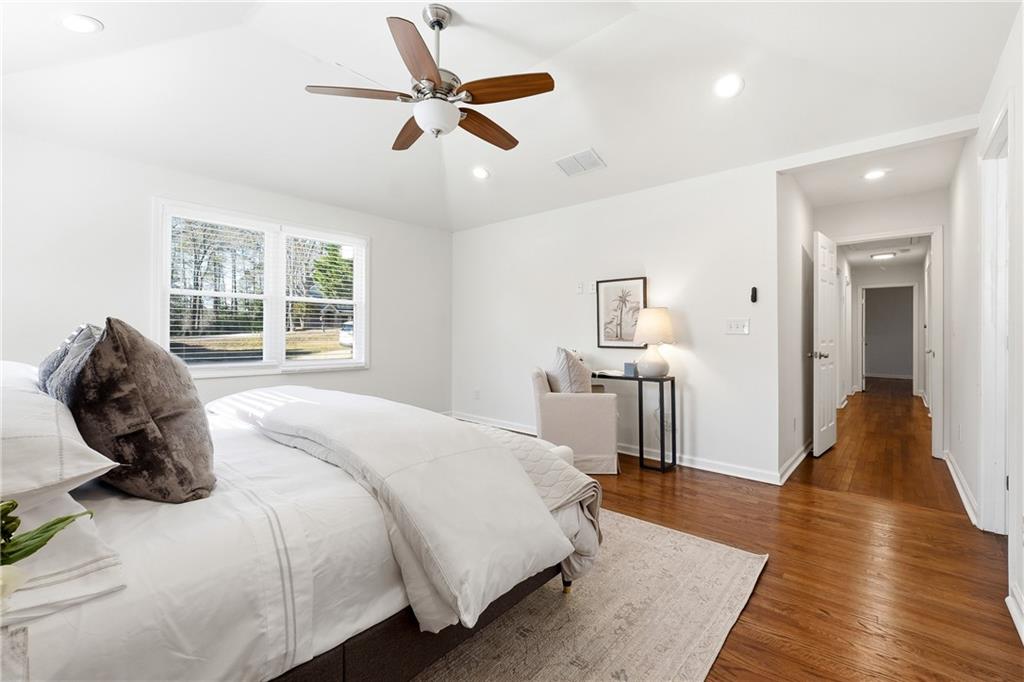 2629 Henderson Road Tucker, GA 30084 - Photo 17 of 31 a bedroom with a bed and wooden floor