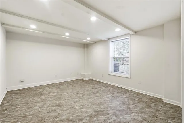 an empty room with a empty space and window