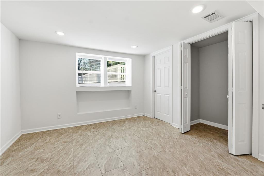 2629 Henderson Road Tucker, GA 30084 - Photo 25 of 31 wooden floor in an empty room with a window
