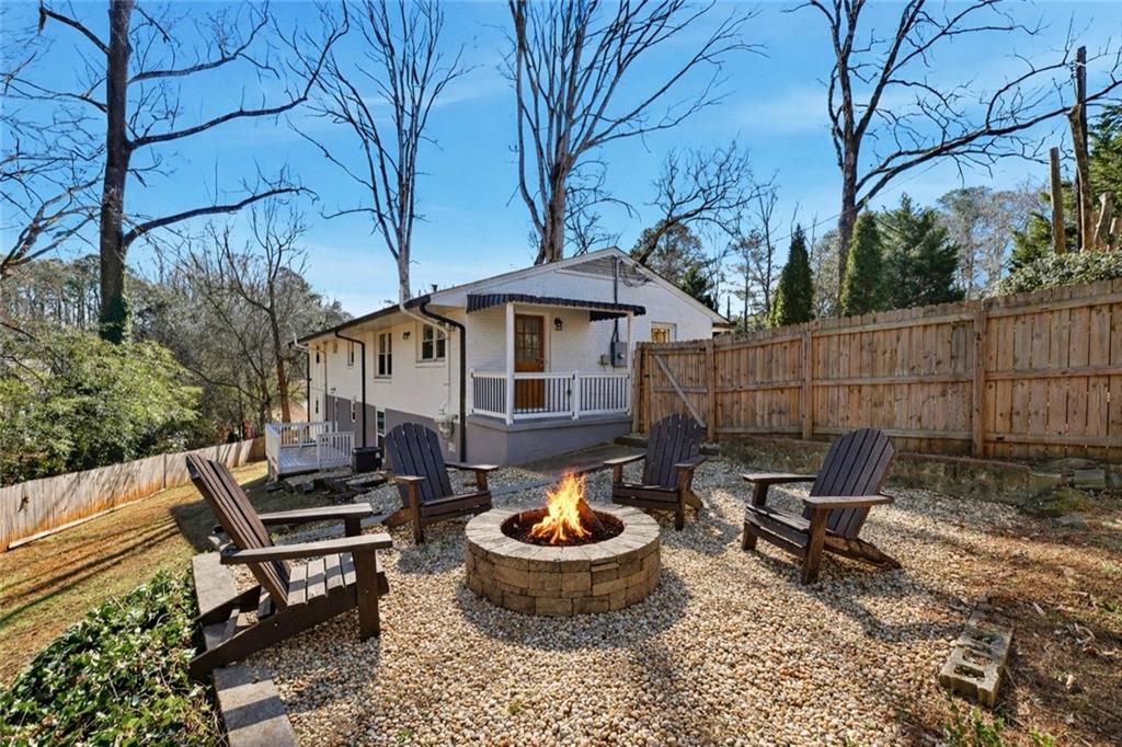 2629 Henderson Road Tucker, GA 30084 - Photo 26 of 31 a view of a backyard with table and chairs and potted plants