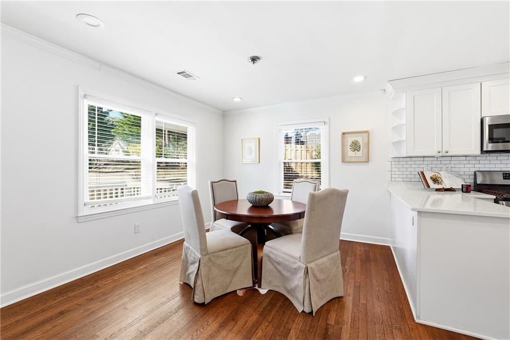 2629 Henderson Road Tucker, GA 30084 - Photo 6 of 31 a dining room with furniture and wooden floor