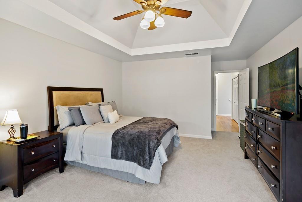 541 Battleview Drive Smyrna, GA 30082 - Photo 15 of 25 a bedroom with a bed and a flat tv screen on dresser