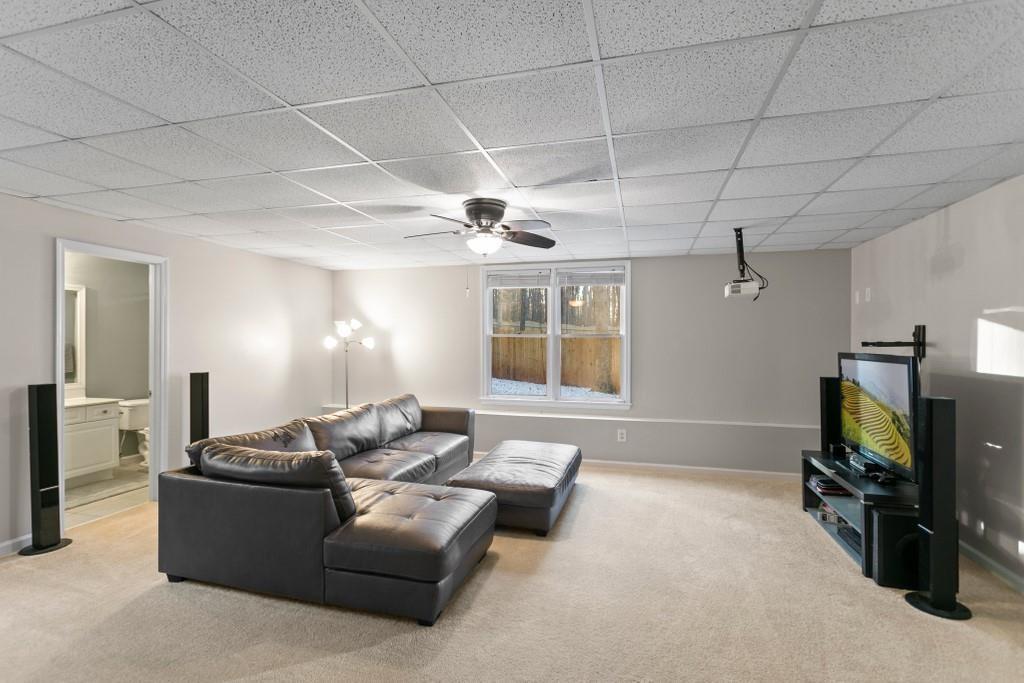 541 Battleview Drive Smyrna, GA 30082 - Photo 19 of 25 a living room with furniture and a flat screen tv