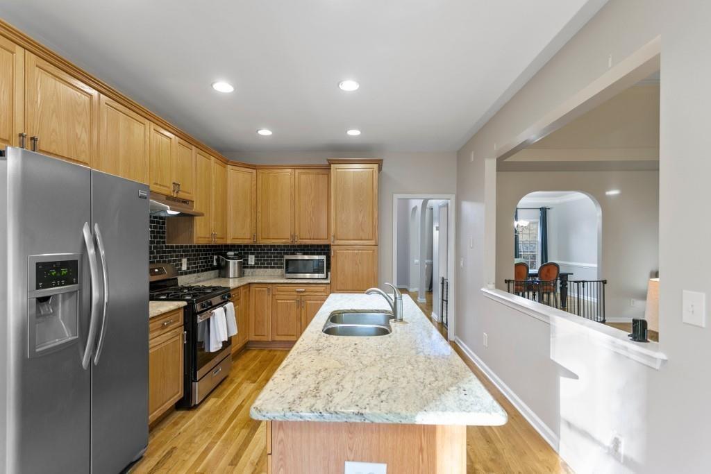 541 Battleview Drive Smyrna, GA 30082 - Photo 5 of 25 a large kitchen with kitchen island a large counter top stainless steel appliances and cabinets