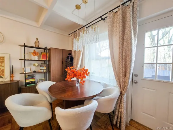 a dining room with furniture and window