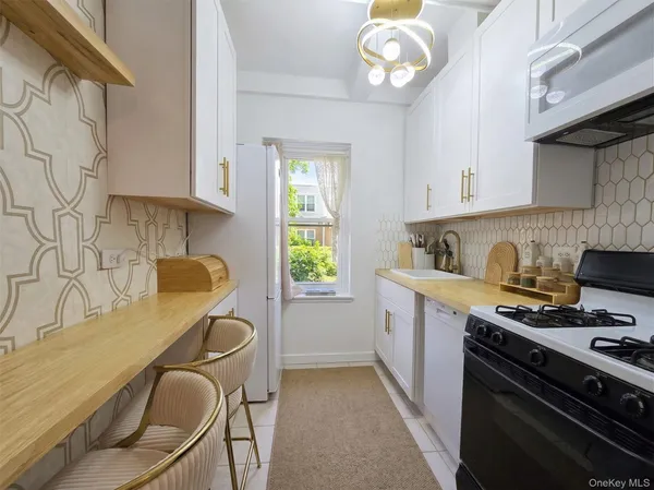 a kitchen with a sink cabinets and window