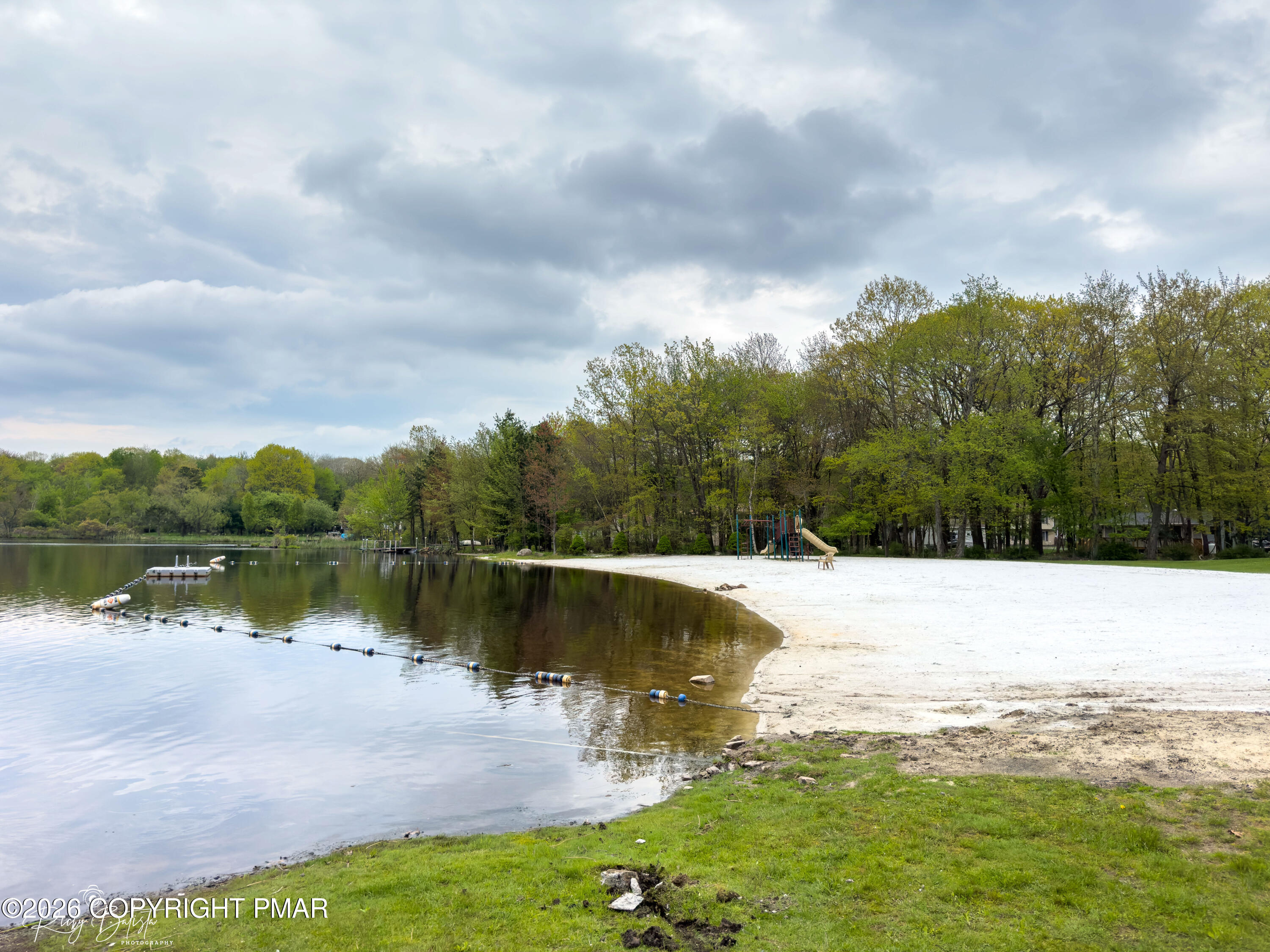 2137 Freedom Way Pocono Summit, PA 18346 - Photo 42 of 71 a view of a lake with a yard