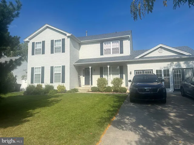 a car parked in front of a house