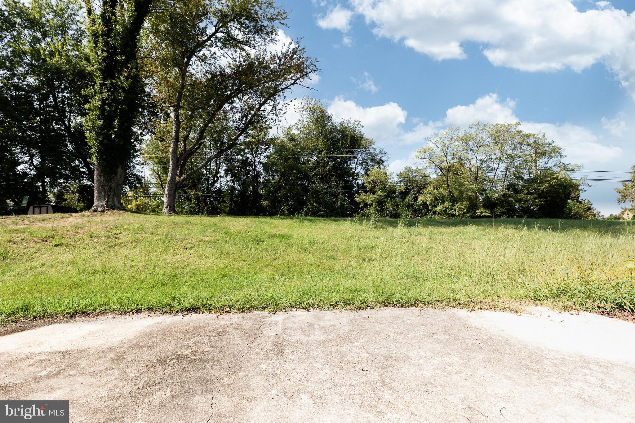 1116 Kings Tree Drive Bowie, MD 20721 - Photo 14 of 15 a view of a garden with a bench