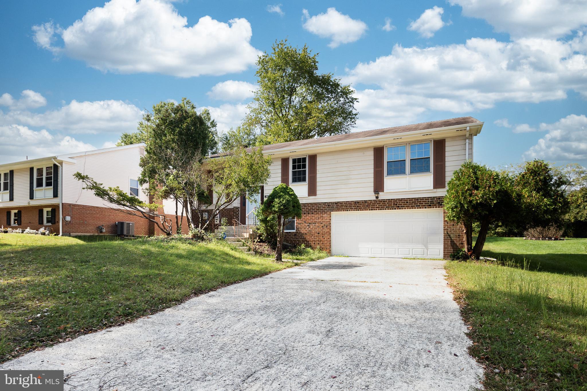 1116 Kings Tree Drive Bowie, MD 20721 - Photo 4 of 15 a front view of house with yard and green space