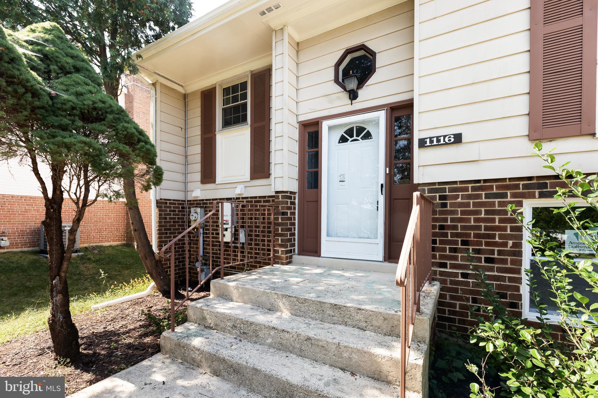 1116 Kings Tree Drive Bowie, MD 20721 - Photo 6 of 15 a front view of a house with a garden