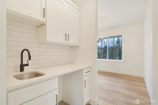 a close view of a sink a faucet and appliance in the kitchen