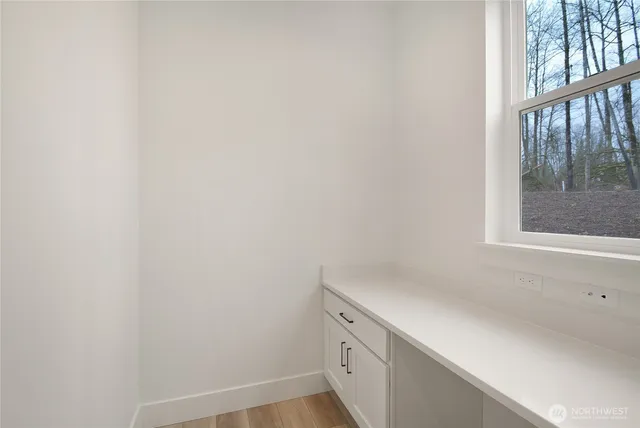 a view of cabinets and window