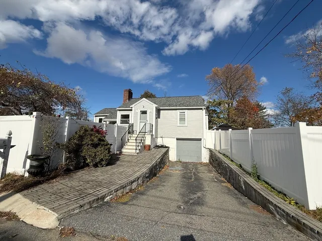 a view of house with yard and entertaining space