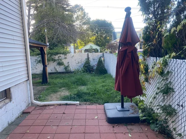 a view of a back yard with a patio