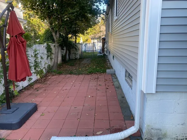 a view of a backyard with small cabin