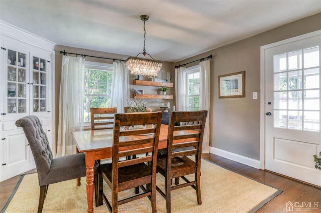 87 Chestnut Street Milltown, NJ 08850 - Photo 13 of 51 a dining room with furniture a chandelier and wooden floor
