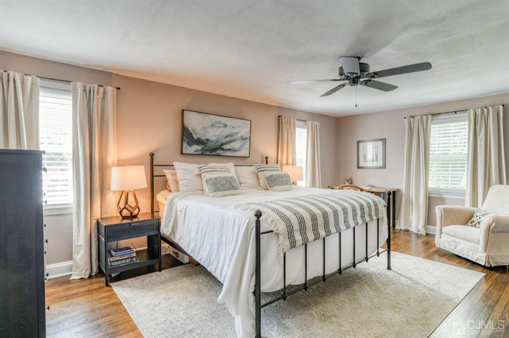 87 Chestnut Street Milltown, NJ 08850 - Photo 19 of 51 a bedroom with a bed and a chandelier