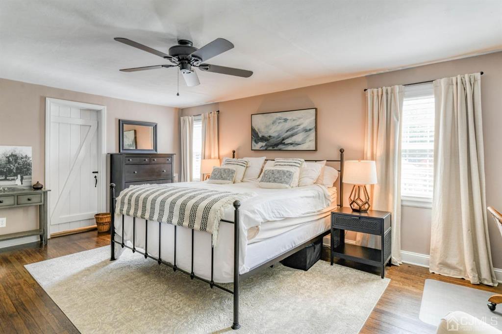 87 Chestnut Street Milltown, NJ 08850 - Photo 20 of 51 a bedroom with a bed and a chandelier