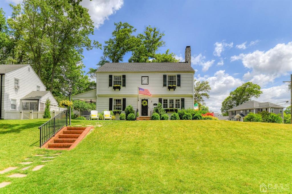 87 Chestnut Street Milltown, NJ 08850 - Photo 2 of 51 a front view of a house with yard and green space