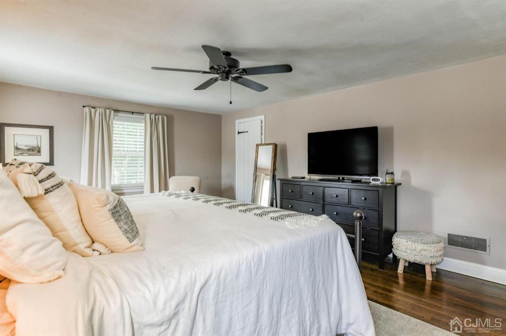 87 Chestnut Street Milltown, NJ 08850 - Photo 21 of 51 a bedroom with a bed and a flat screen tv