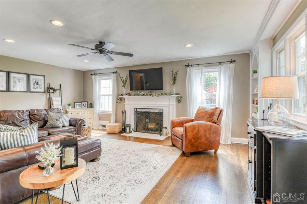 87 Chestnut Street Milltown, NJ 08850 - Photo 4 of 51 a living room with furniture fireplace and a flat screen tv