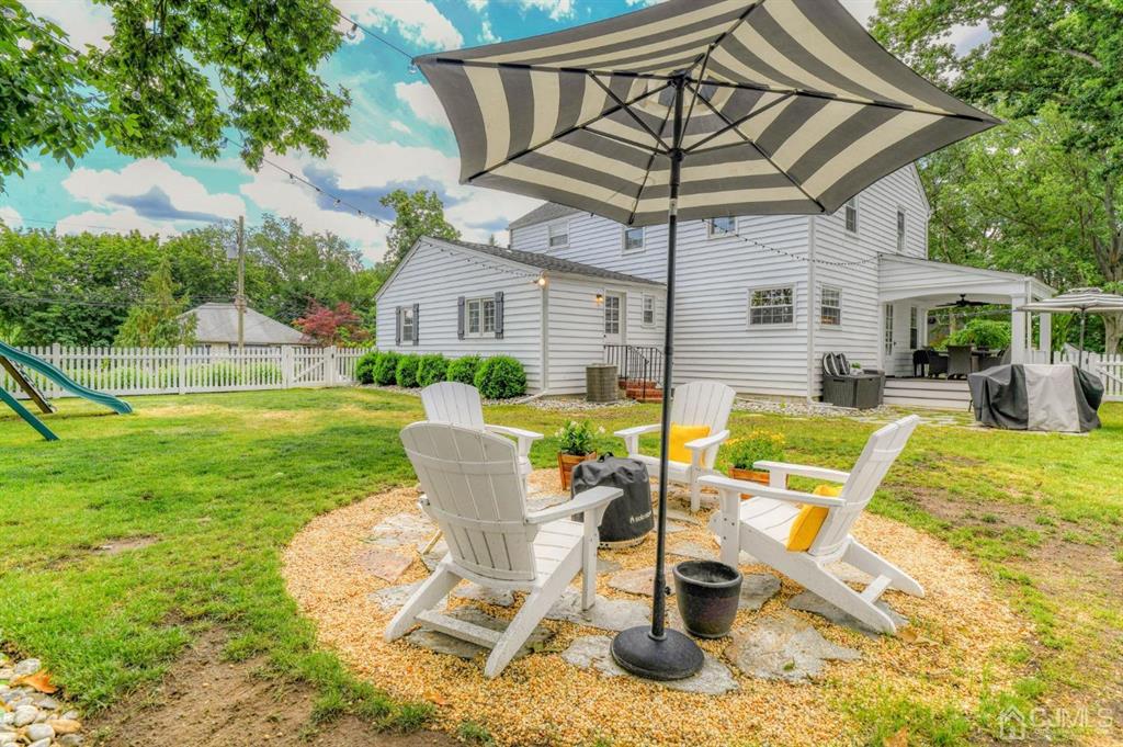 87 Chestnut Street Milltown, NJ 08850 - Photo 41 of 51 a view of a swimming pool with a patio