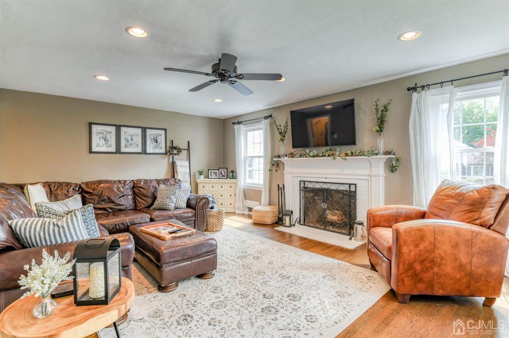 87 Chestnut Street Milltown, NJ 08850 - Photo 5 of 51 a living room with furniture or fireplace and a flat screen tv