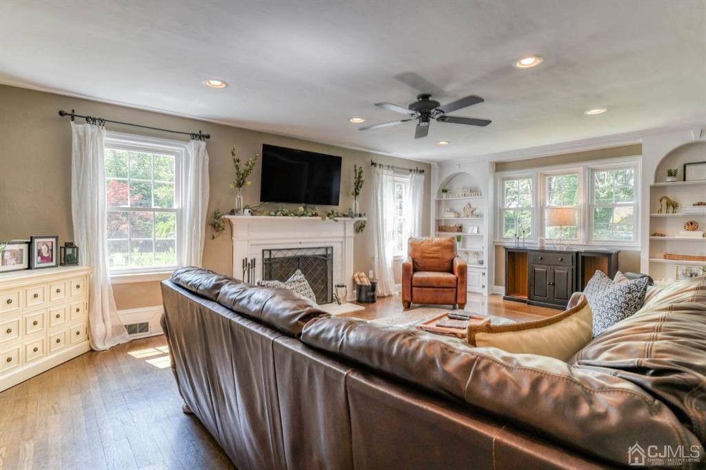 87 Chestnut Street Milltown, NJ 08850 - Photo 6 of 51 a living room with furniture fireplace and a flat screen tv