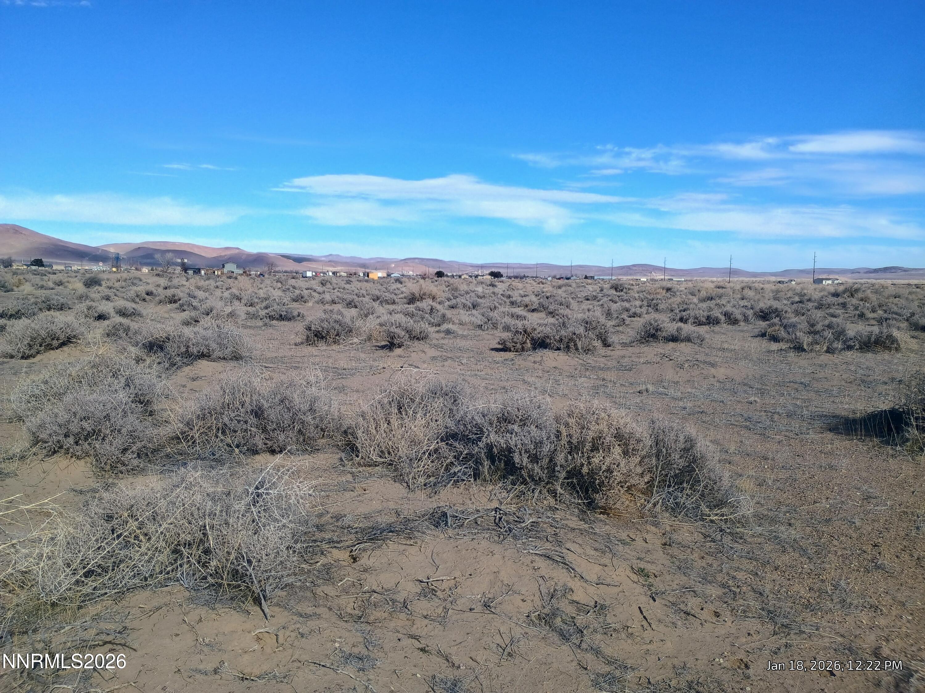 3810 Ft Churchill Street Silver Springs, NV 89429 - Photo 6 of 14 a view of a dry yard with wooden fence