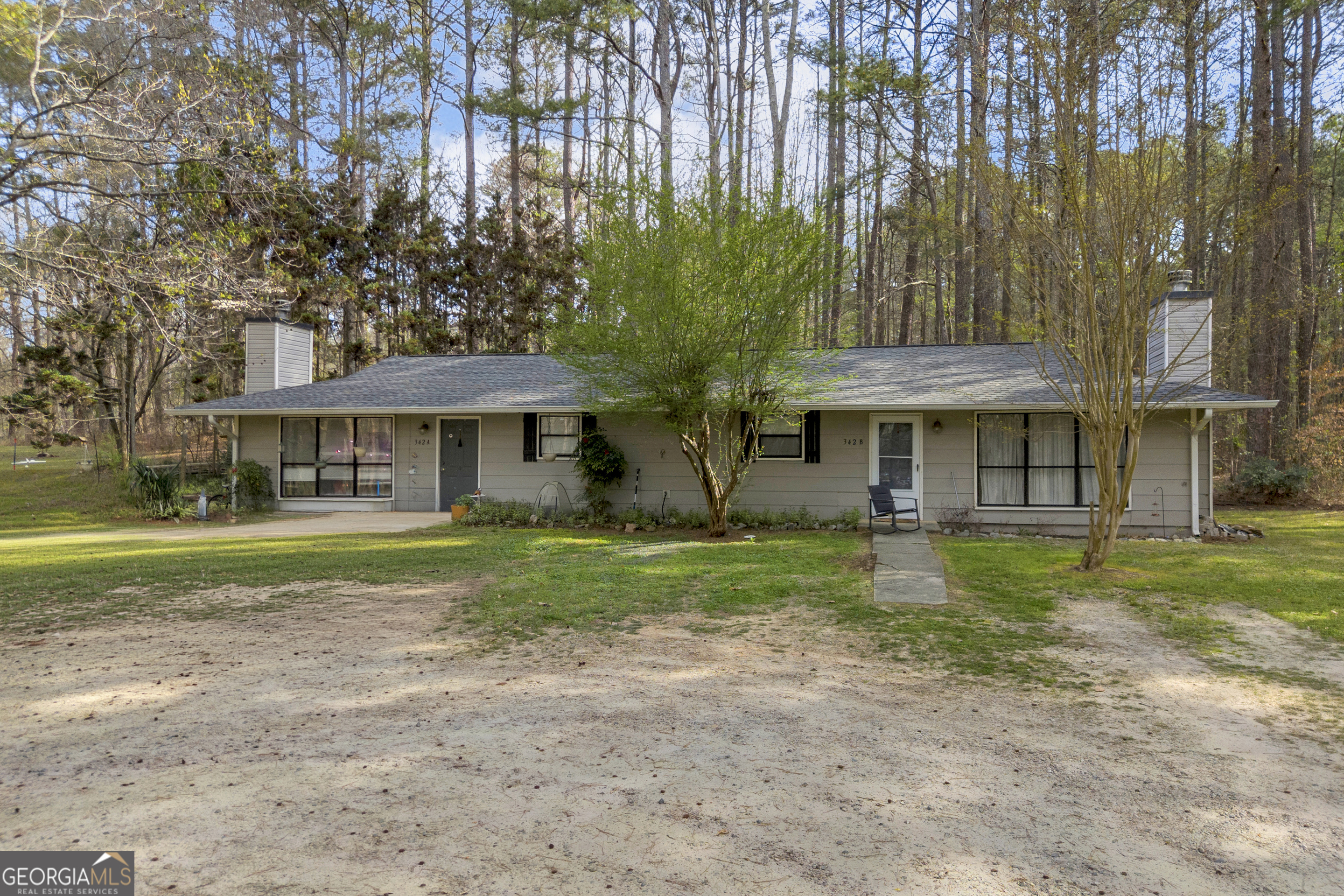 342 Brown Bridge Road Auburn, GA 30011 - Photo 16 of 74 a front view of a house with garden
