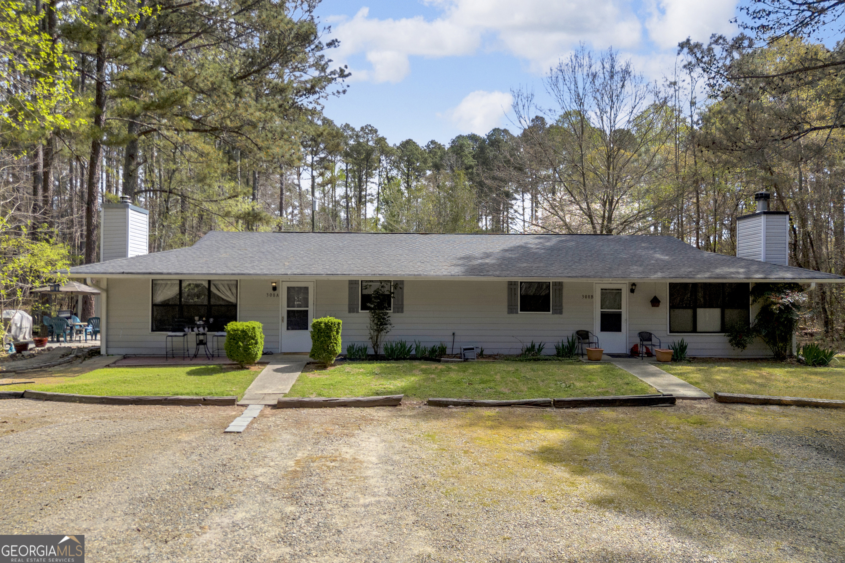342 Brown Bridge Road Auburn, GA 30011 - Photo 39 of 74 a view of a house with swimming pool and sitting area