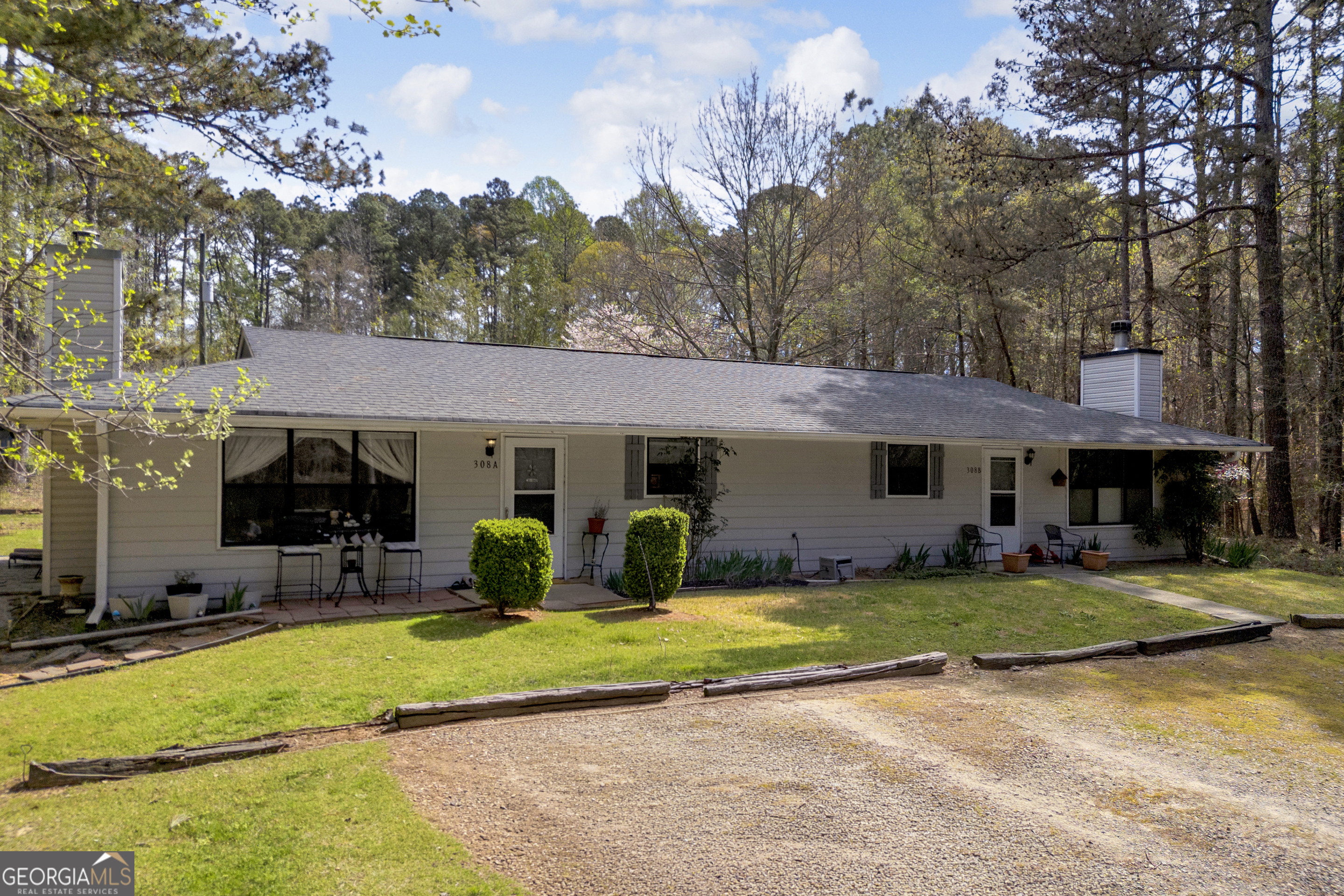 342 Brown Bridge Road Auburn, GA 30011 - Photo 40 of 74 a view of a house with swimming pool and sitting area