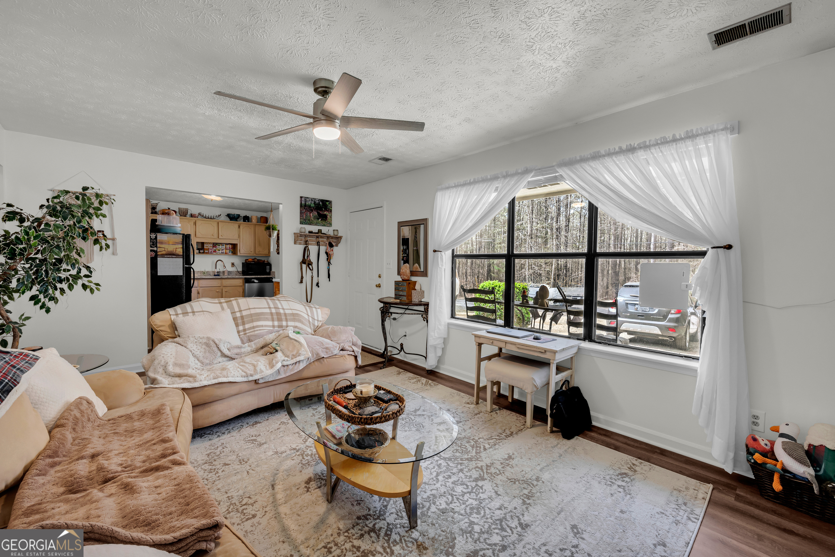 342 Brown Bridge Road Auburn, GA 30011 - Photo 65 of 74 a living room with furniture and a window