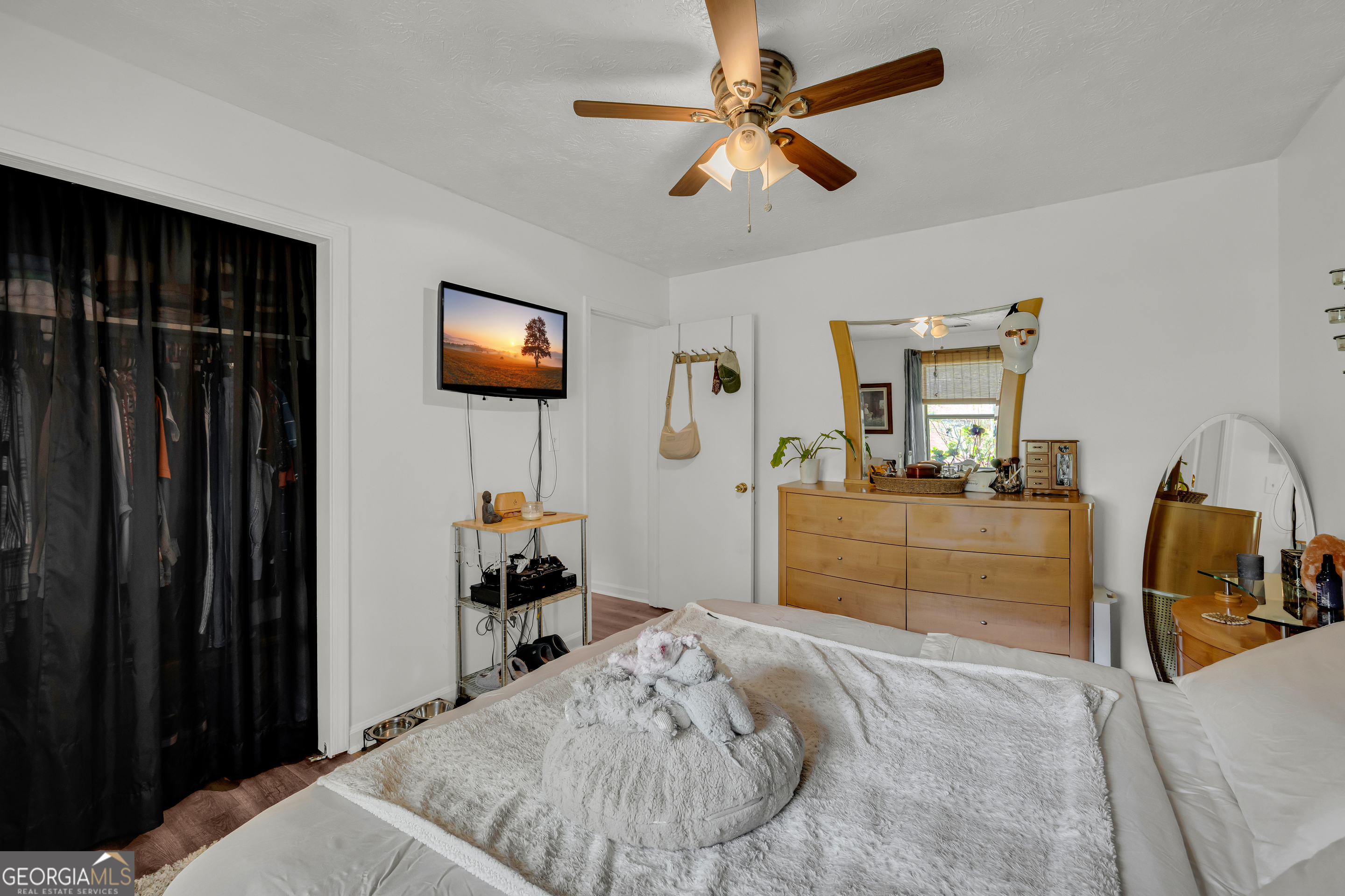 342 Brown Bridge Road Auburn, GA 30011 - Photo 70 of 74 a bedroom with a bed and a chandelier