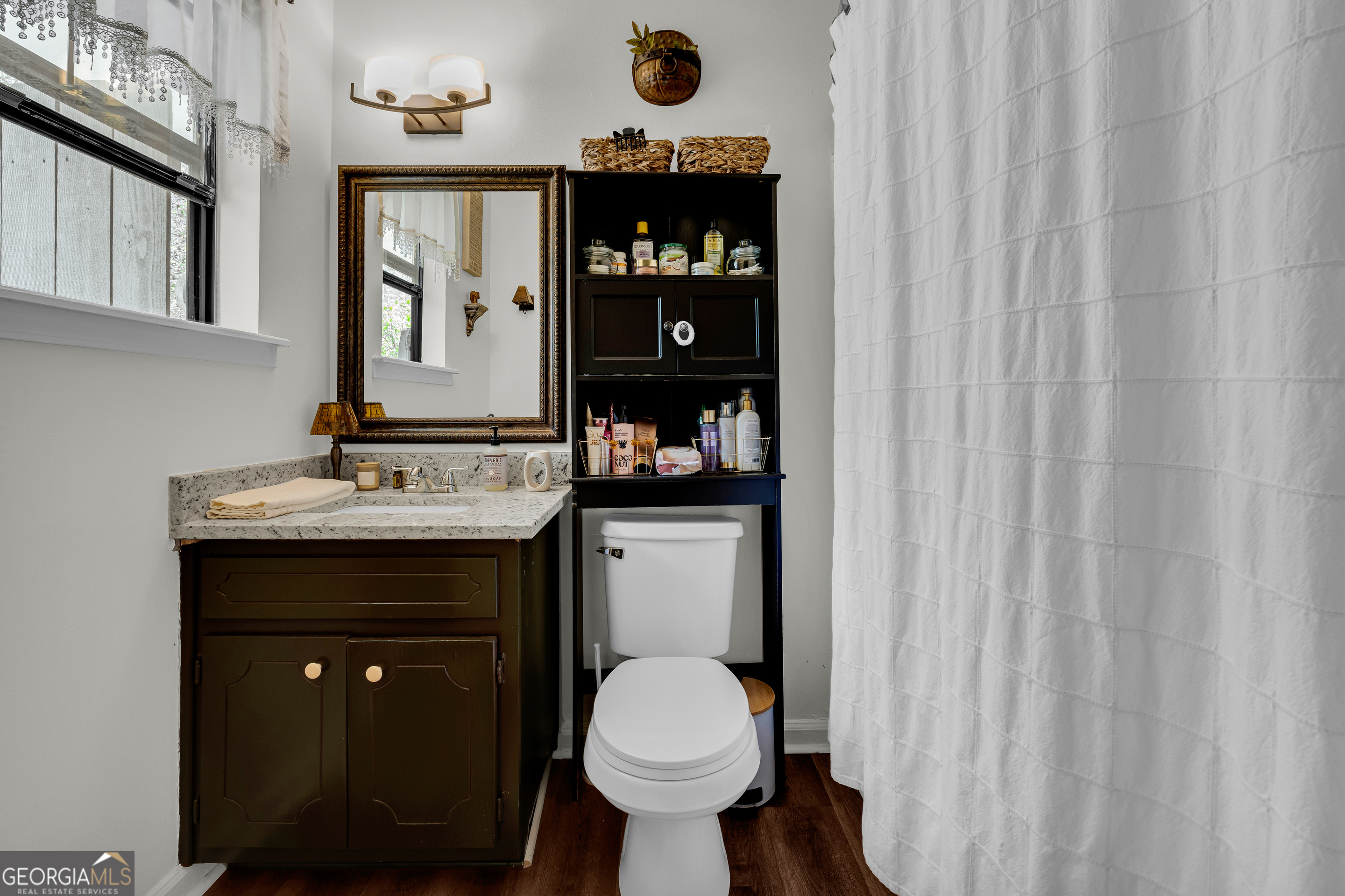 342 Brown Bridge Road Auburn, GA 30011 - Photo 73 of 74 a bathroom with a sink a toilet and shower