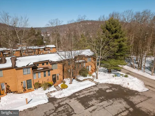 a balcony with wooden floor and fence