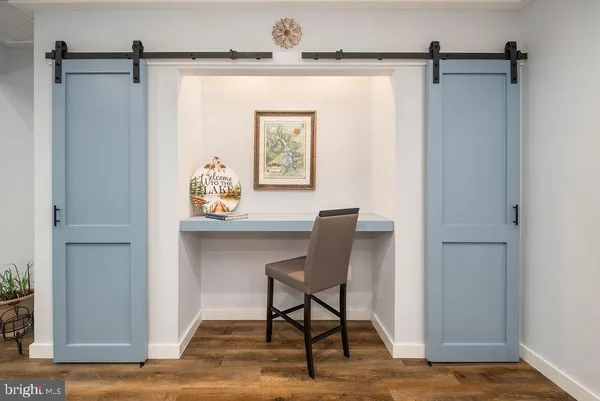 a workspace with furniture and a window